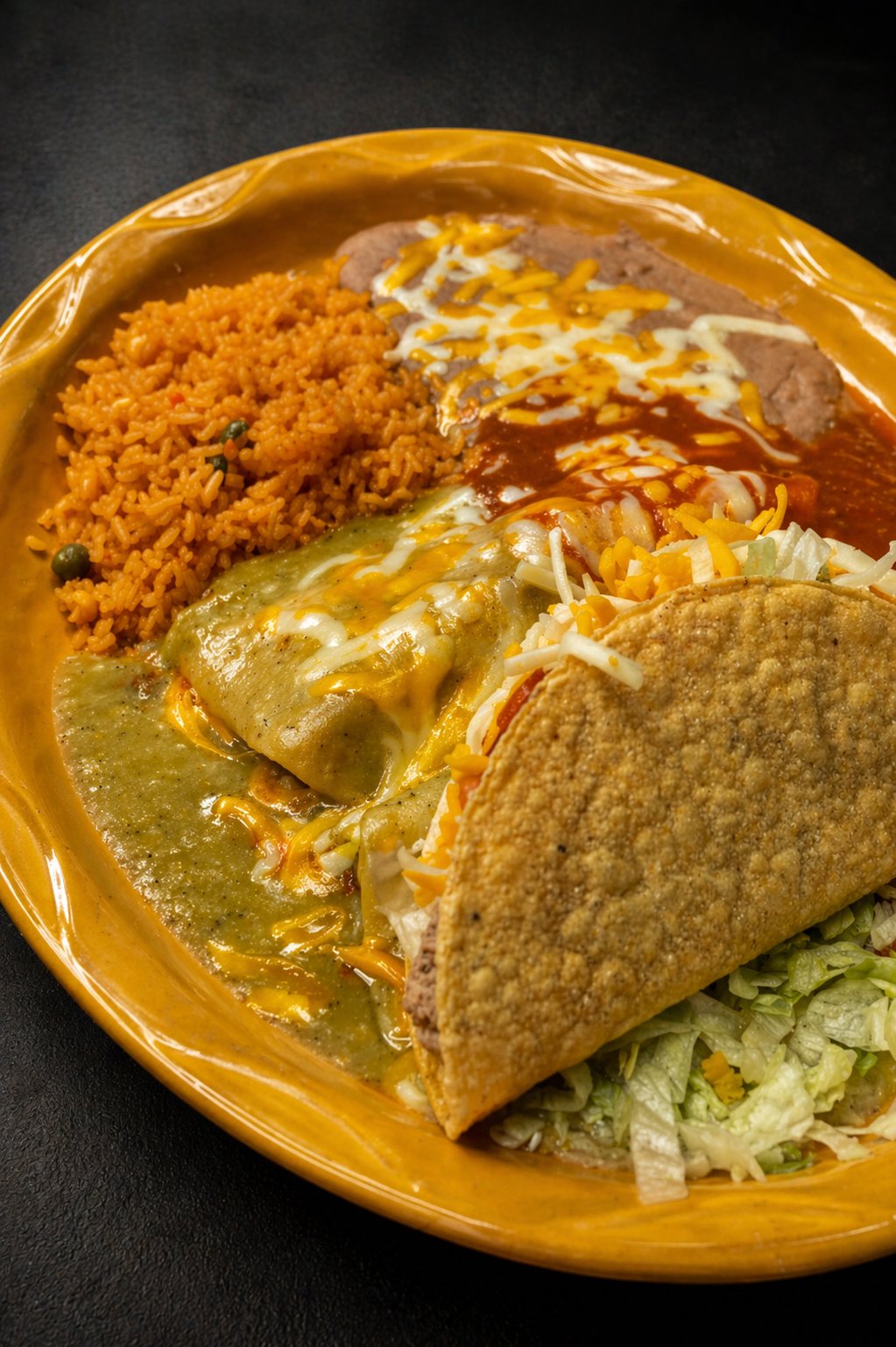 Heart and Soul Mexican Grill combo plate with rice, beans, enchilada, and taco