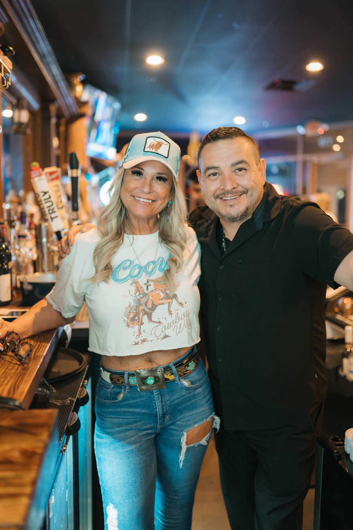 Guests smiling at the Heart and Soul Mexican Grill bar